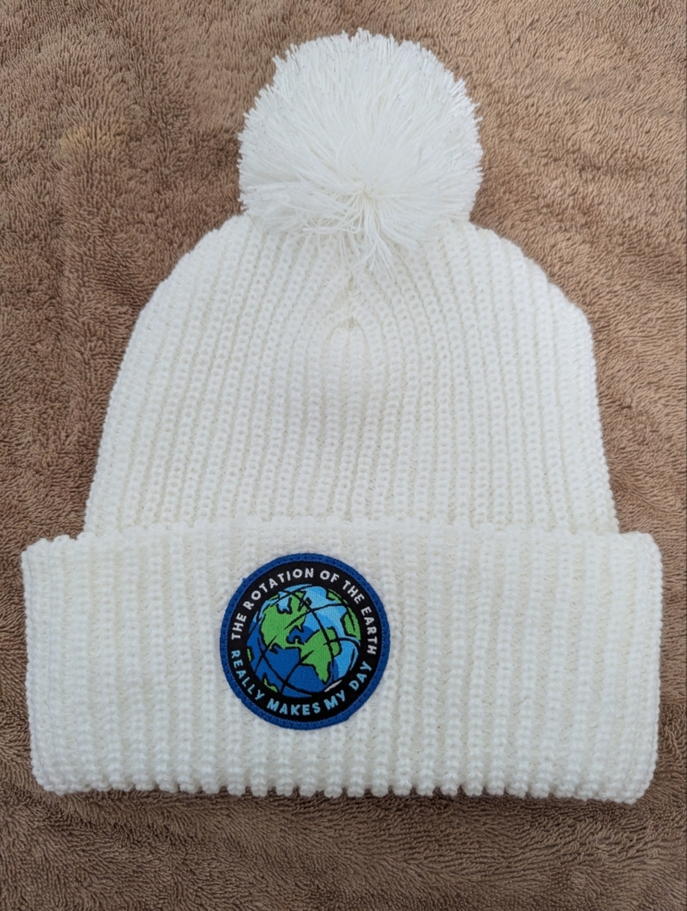 White Knit Pom Pom Beanie with Earth Patch